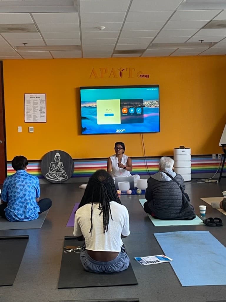 Nakhone Keodara leading a group session at APAIT Health Center