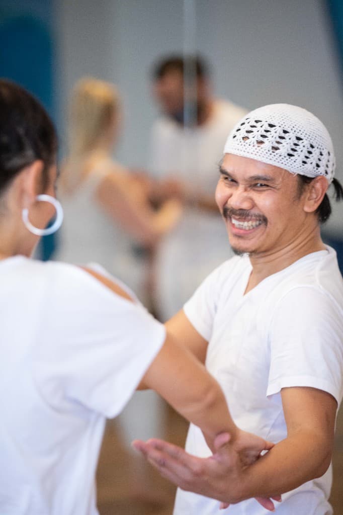 Nakhone Keodara leading a joyful breathwork and movement session