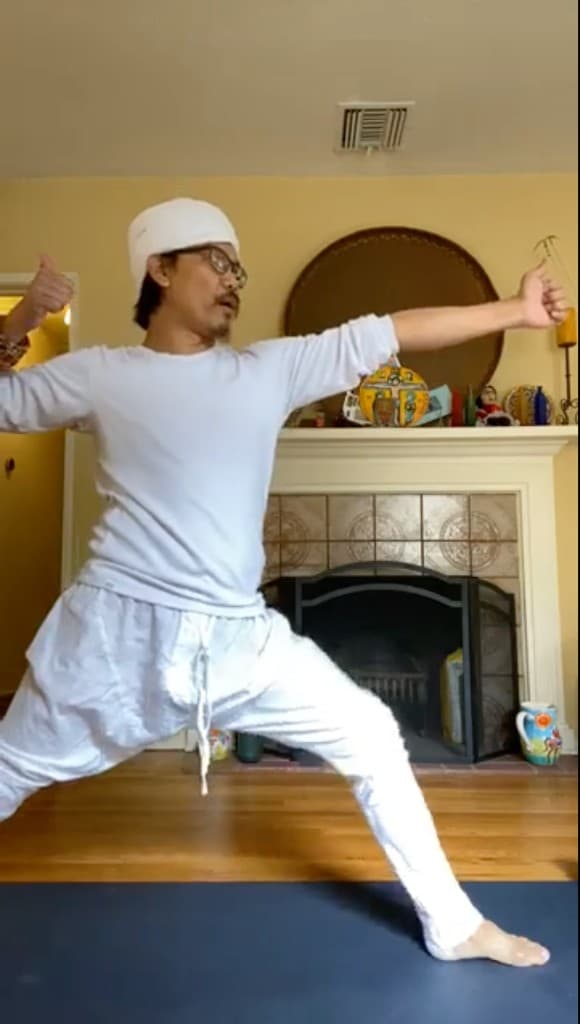 Nakhone Keodara in Archer pose during Kundalini Yoga