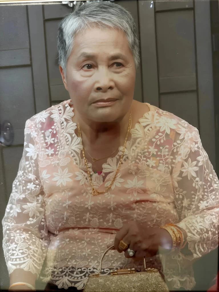 Nakhone's mother, Bounmy, a traditional healer and weaver