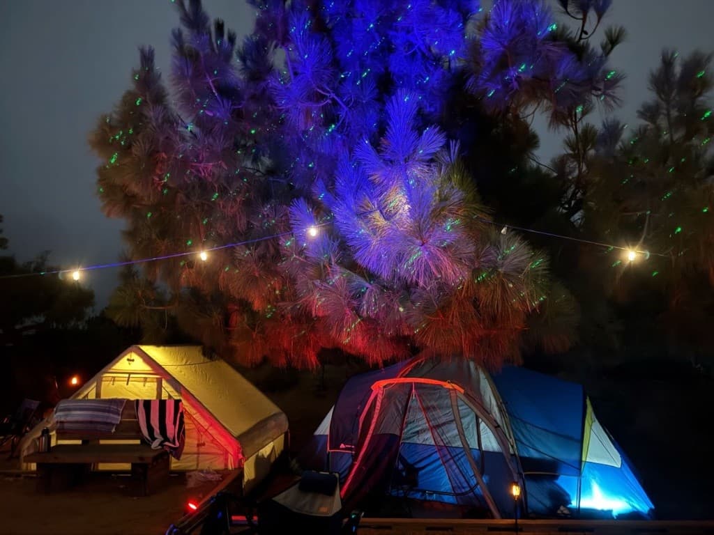 Illuminated outdoor retreat campsite at night